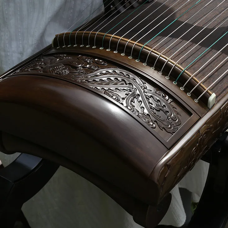 

high-grade 21 string Guqin style carving guzheng Nanmu phoenix perched on peony pattern guzheng chinese zither