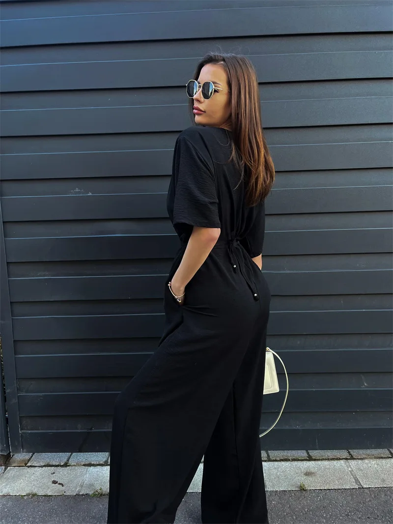 気質通勤レディースジャンプスーツ2025夏新作無地タイウエストディープVネックカジュアルジャンプスーツワイドレッグパンツ