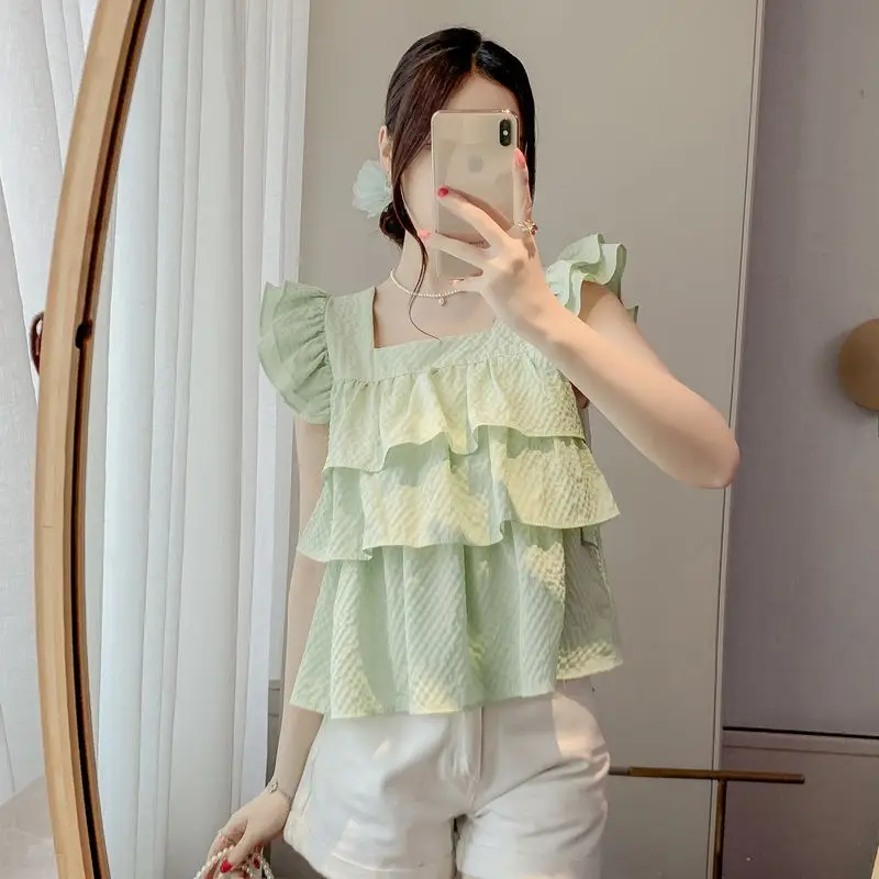 

Топ с рюшами по подолу Пышная короткая рубашка Мятно-зеленый шифон с развевающимися рукавами