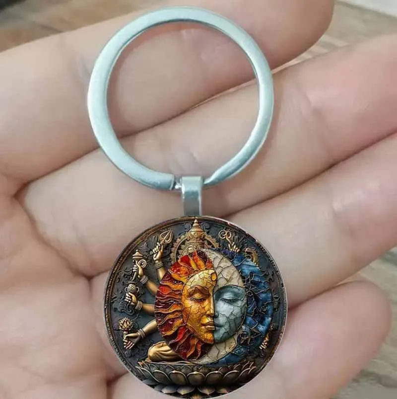 

A keychain pendant with sun and moon design, perfect for decorating your car