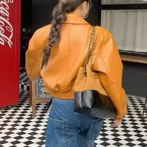 Utländsk stil modern vit orange läderjacka dam höst koreansk version lös och tunn midja jacka 10 best sales orange jacka för kvinnor - №6
