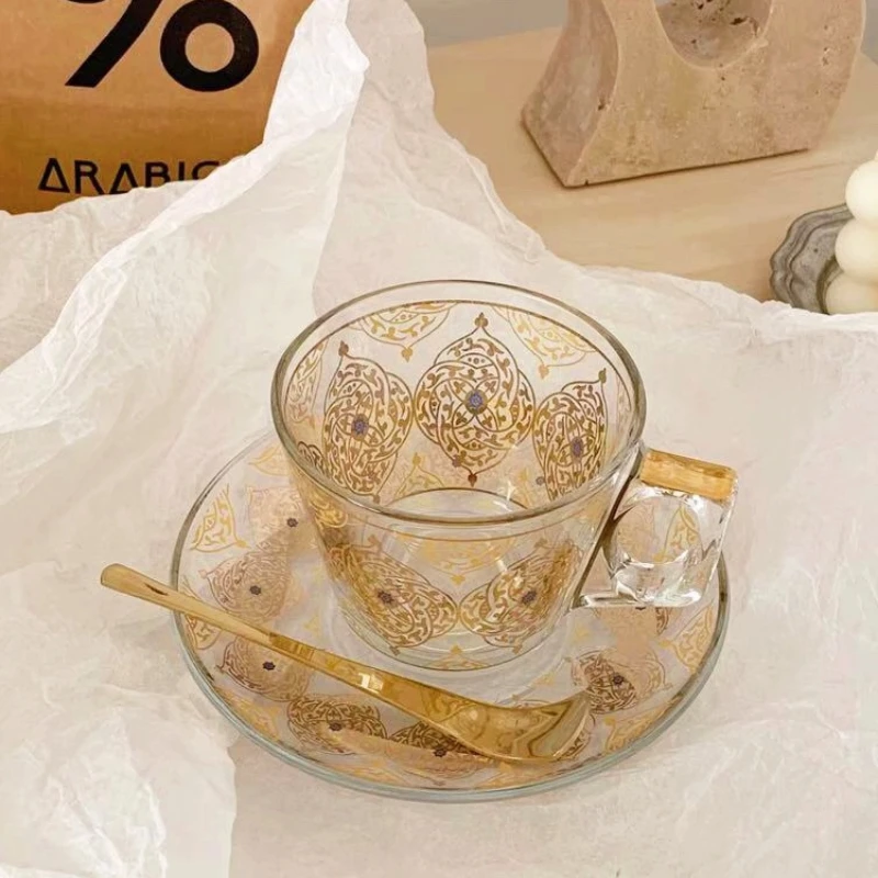 Luxury, golden vintage exquisite glass, black tea cup with complimentary spoon