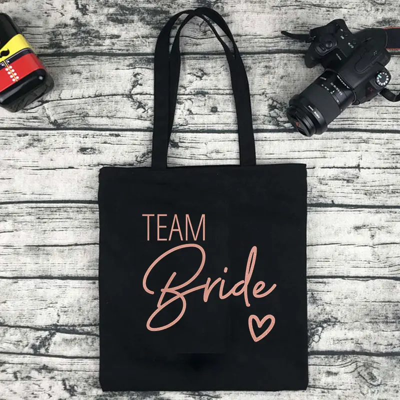 Team Bride-Bolso de mano grande e informal para mujer, bolsa de compras de lona con estampado de fuentes Rosas y blancas, de alta calidad, lavable