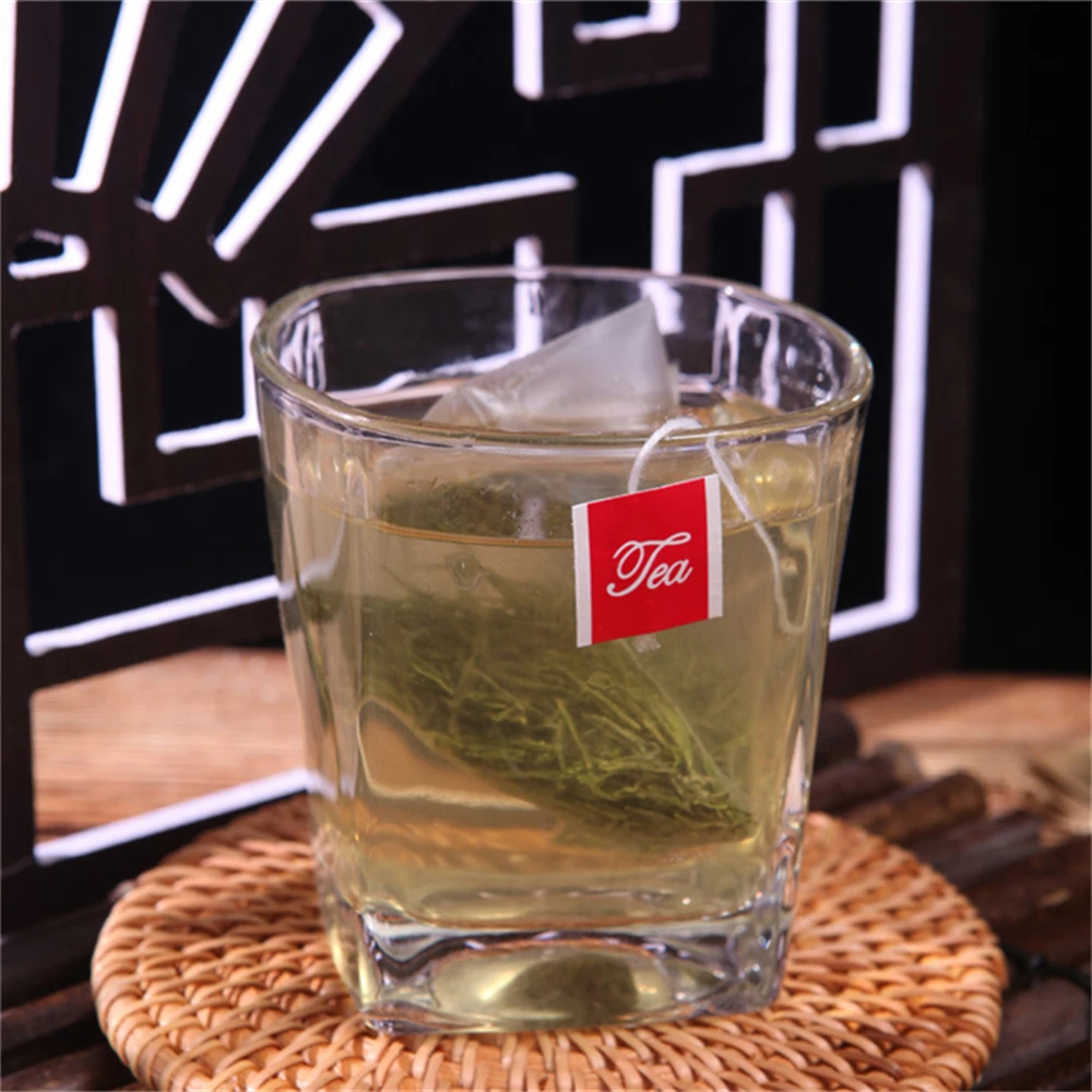 

1000 шт. чайные пакетики в форме пирамиды 5,5x7 см, нейлоновая одинарная нить с этикеткой, прозрачные пустые фильтры, оптовая продажа XB