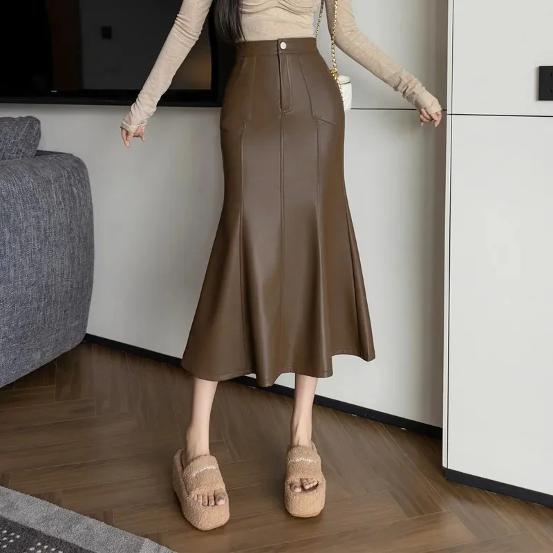 خمر عالية الخصر بولي Leather التنانير الجلدية للنساء 2026 الخريف الشتاء جديد عصري ذيل السمكة ملفوفة قلم رصاص التنانير الإناث #1