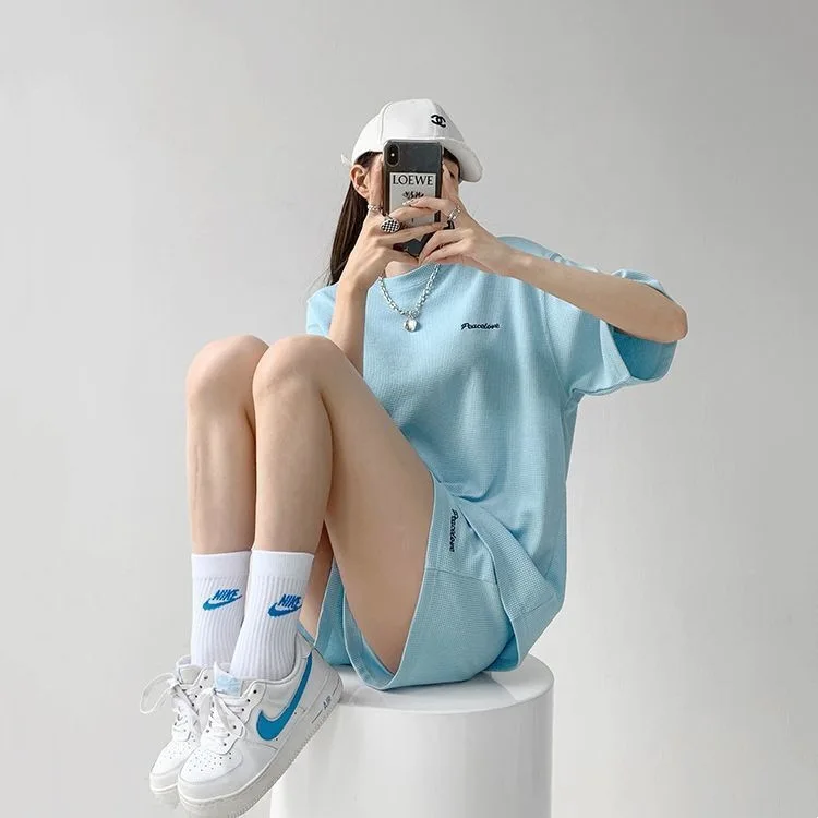 Koreaanse stijl casual sportpak dames zomer nieuwe losse en afslankende T-shirt met korte mouwen shorts modieuze tweedelige set