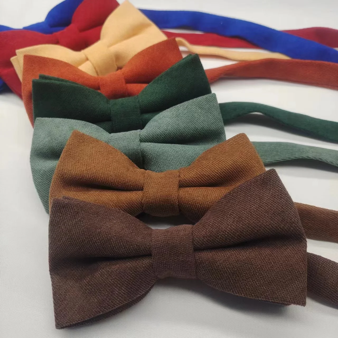 classic solid-color wedding, a groom's and a bride's bow ties, a coffee-colored dark green caramel pocket scarf