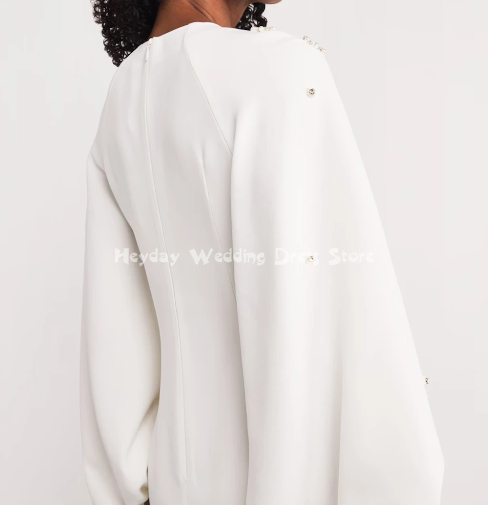 ชุดราตรีทรงตรงแบบมีลูกปัด คอทรงโอ แขนยาว ยาวถึงข้อเท้า ดีไซน์หรูหราสำหรับงานปาร์ตี้  คอลเลคชั่น Heyday Customized สำหรับผู้หญิง ปี 2025