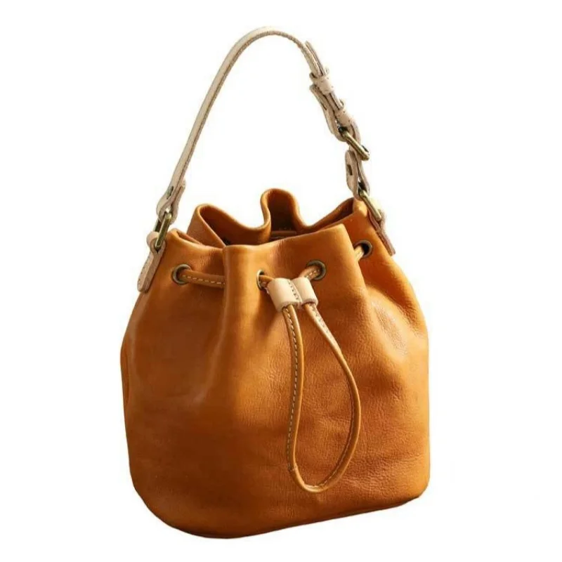 New Natural Leather Drawstring Bucket Bag with Adjustable Shoulder Straps for Vintage Style Tassel Style Fashionable Women\'s Bag