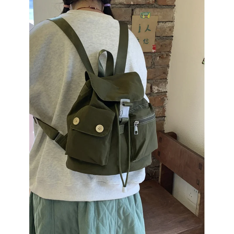 Korean-style niche design pocket button backpack, college-style versatile student schoolbag, casual travel nylon backpack
