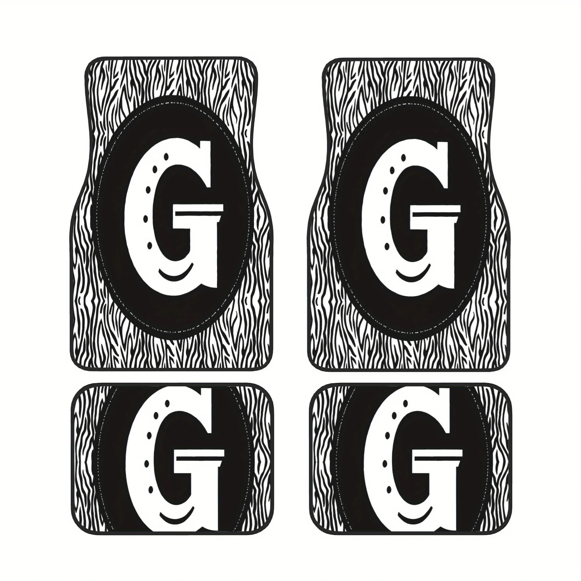 A Set Of Four Car Floor Mats Featuring A Black And White Zebra Pattern Shaped Like The Letter G, Perfect For Everyday Use, Weeke