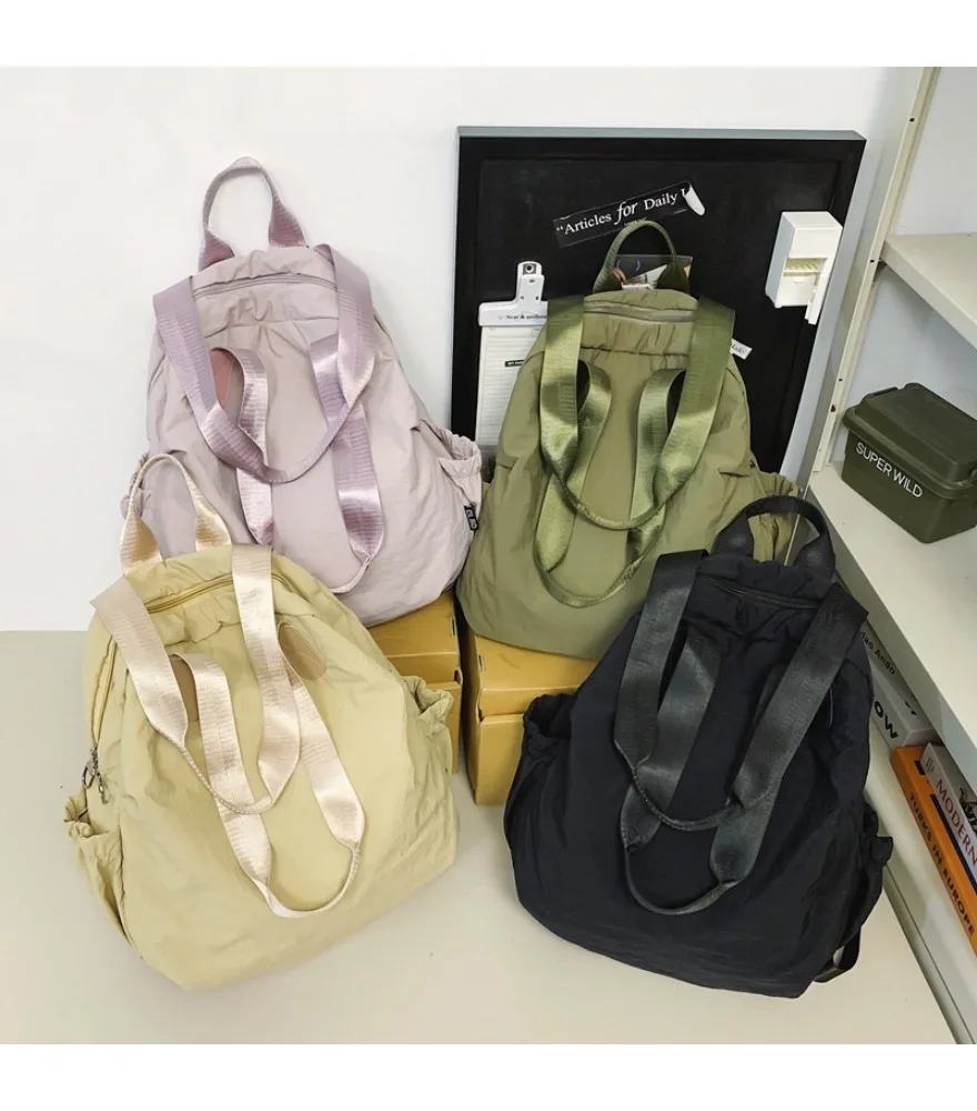 Casual backpack New men and women couple nylon handbag Simple lightweight and fashionable niche backpack