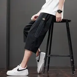 Capris de seda de hielo para hombre, cintura elástica sólida, cordón, bolsillo de retazos, pantalones cortos rectos delgados, transpirables, versátiles, novedad de verano