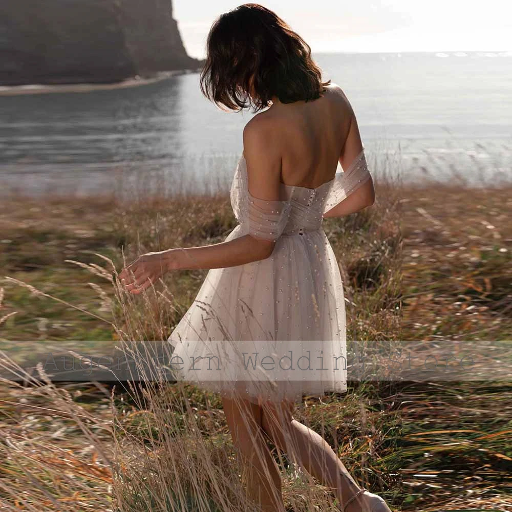 فساتين زفاف ساحرة للضيوف من التل على شكل حرف a فساتين حفلات الزفاف بيضاء مكشوفة الكتف مطوي لؤلؤ برباط فساتين زفاف #2