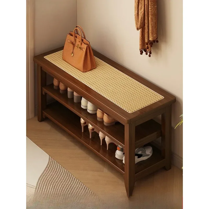 The shoe change stool is solid wood at door of the home, and you can sit on  shoe stool to enter home shoe cabinet.