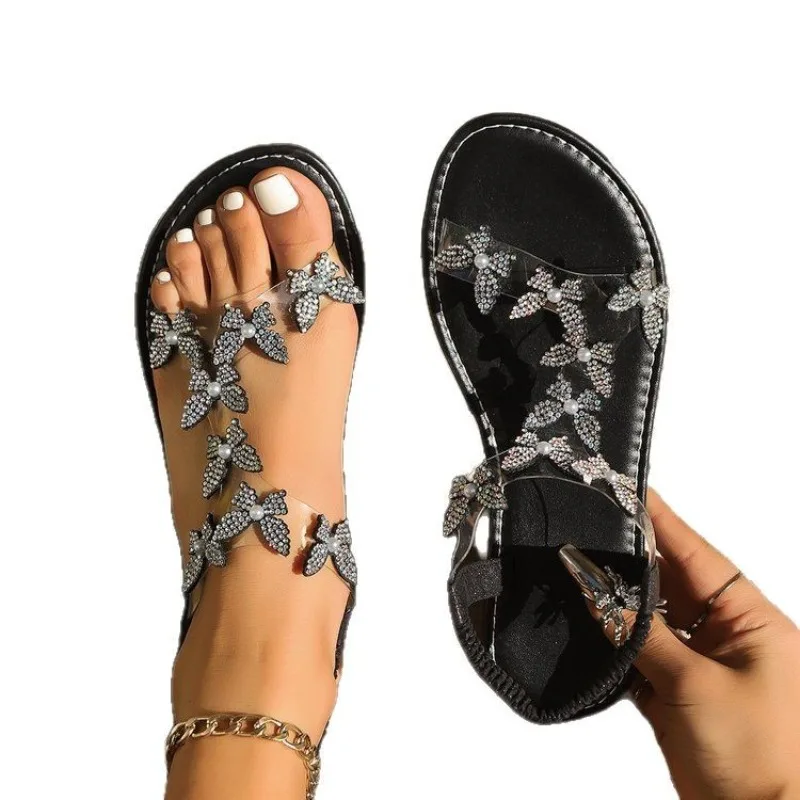 

New butterfly rhinestone flat-soled fish-mouth sandals with adjustable straps and hollow beach flip-flops.