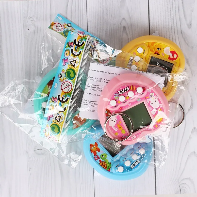 Macchina elettronica per animali domestici a forma di cuore per bambini Tamagotchi Console di gioco portatile Giocattolo Mini portachiavi con ciondolo per animali domestici digitale virtuale Piccoli giocattoli