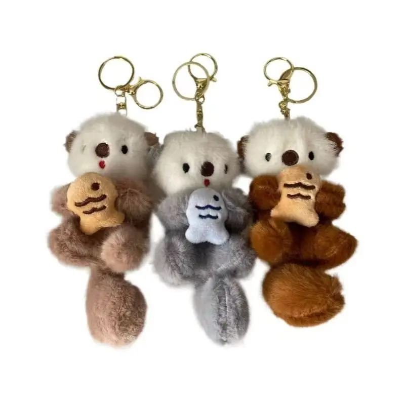 Otte carine che tengono pesci ciondolo in peluche portachiavi zaino portachiavi ciondolo borsa chiave portafoglio ciondolo all'ingrosso