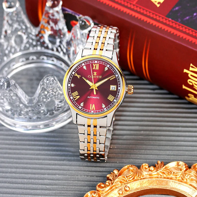 

A women's Gold Steel Strap Trendy Ancient Roman Numeral Calendar Automatic Mechanical Watch