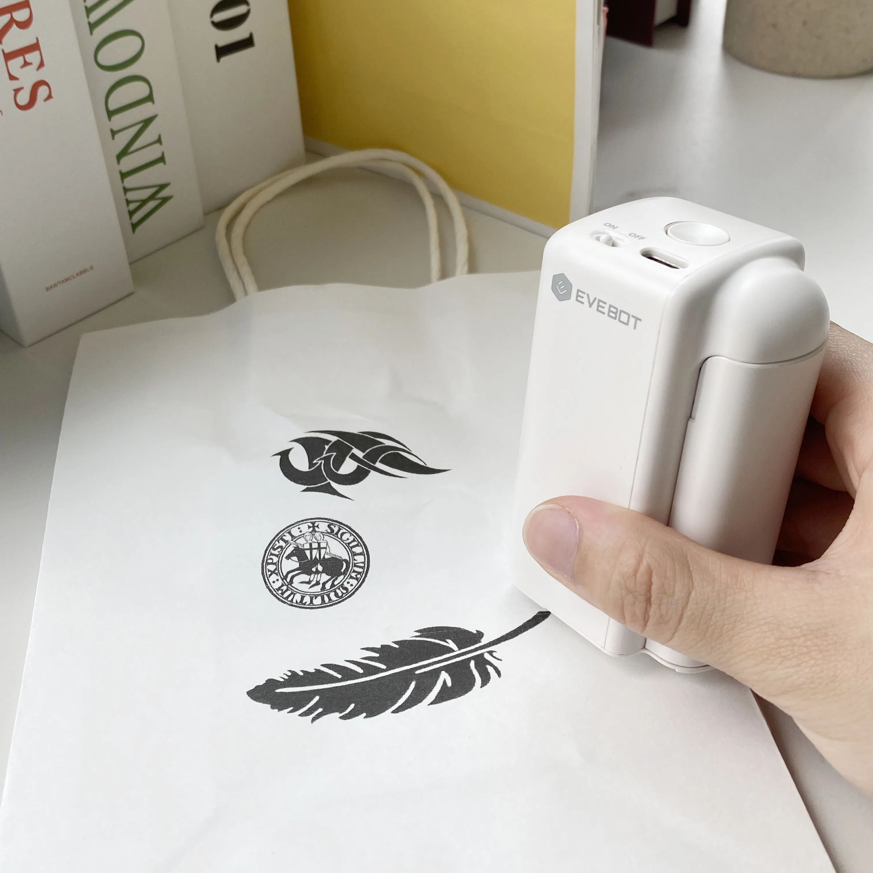 EVEBOT Portable Printer Printpods Mini Inkjet Printers Carton logo