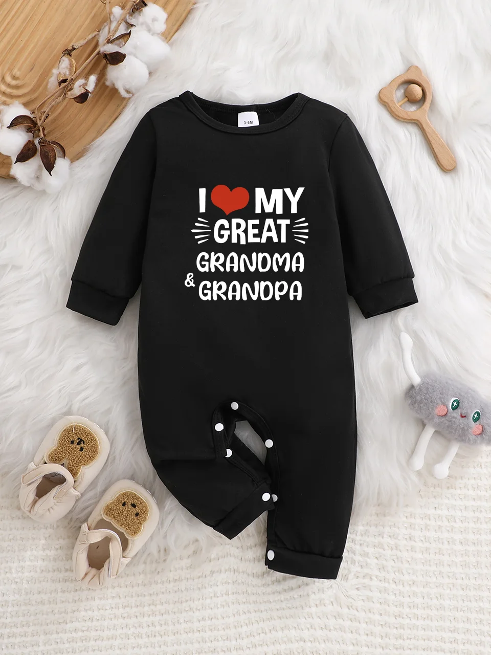 A baby long-sleeved onesie with interesting letter prints. It features a buttoned design for easy putting on and taking off