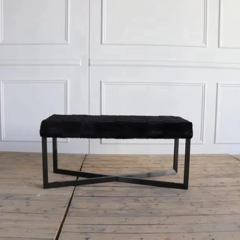 

Plated black stainless steel base black pony leather ottoman