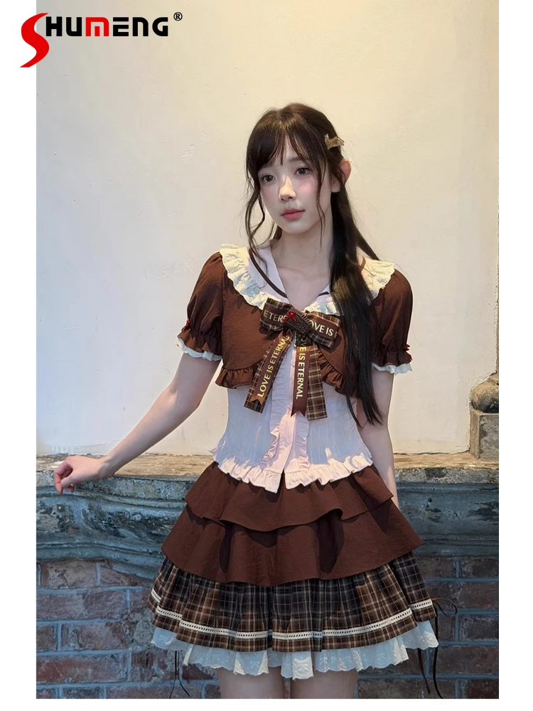 

Комплект из двух предметов в японском стиле: милая блузка с коротким рукавом, воротником-куклой и бантом, и клетчатая короткая юбка-кейк для женщин, лето 2026