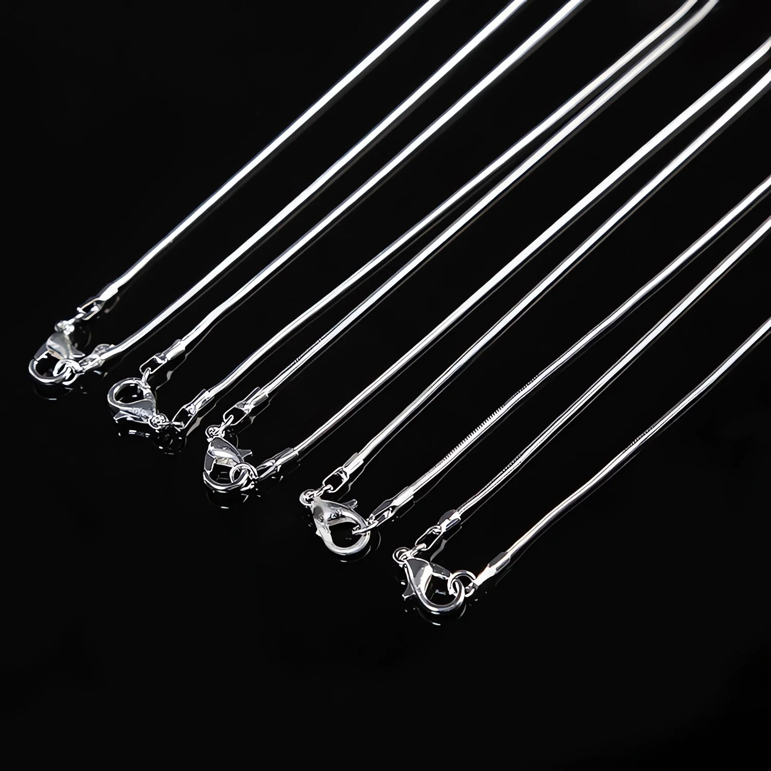 

Hot 10pcs/Lot 16/18/20/22/24/26/28/30 Inch 1.2mm Snake Chain Necklace Silver Color For Woman Man Fashion Jewelry