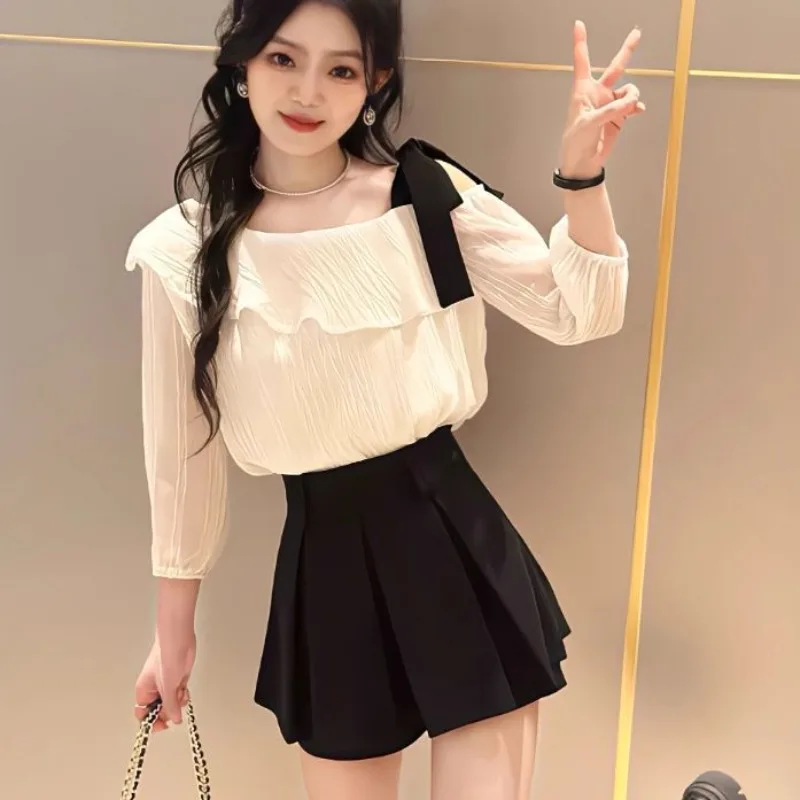 

Женские рубашки весна-лето в консервативном стиле с косым воротником, черные шорты, юбки, комплект из двух предметов, женские изящные топы с бантом, костюм с юбкой