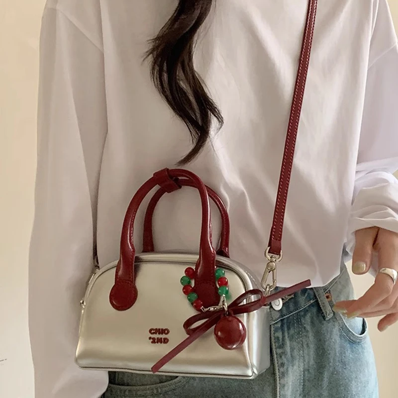 Silver Commuter Shoulder Bags Women Luxury Designer Handbags with Red Ball Pendant Causal Bag Large Capacity Pillow Underarm Bag