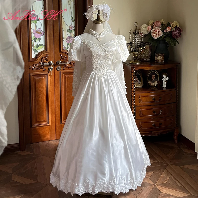 

AnXin SH винтажное белое атласное цветочное кружево с высоким воротником и бисером, жемчугом, пышное свадебное платье с длинными рукавами и большим бантом на шнуровке по индивидуальному заказу