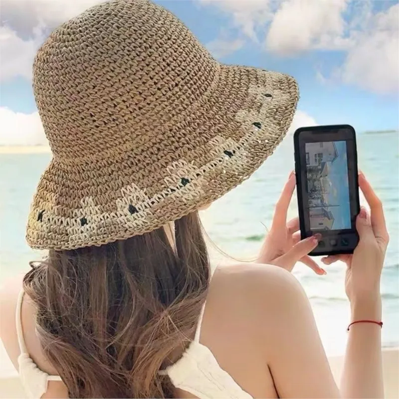 A hat for women fisherman's on the large brim foldable with hollowed-out designs that make face smaller