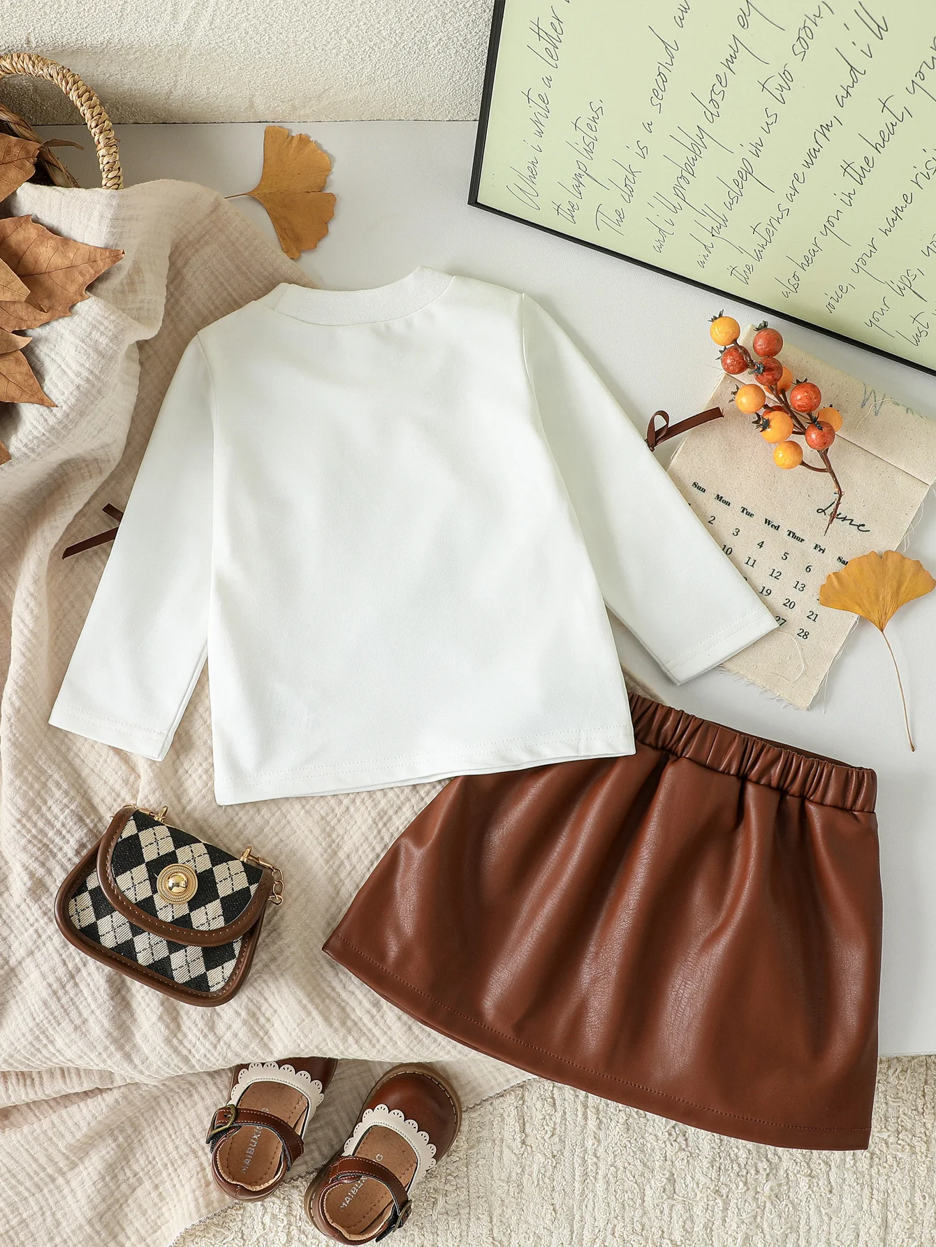 طفل الفتيات الملابس مجموعة ربيع الخريف نمط قصير القوس كم طويل أعلى + تنورة جلدية قصيرة 2 قطعة ل 3-24 متر الفتيات الزي الأنيق