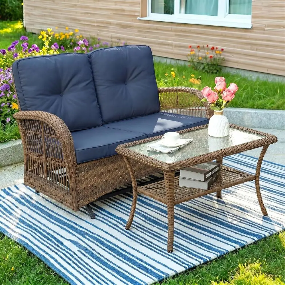 

2-Person Outdoor Wicker Glider Set with Cushions and Glass Coffee Table in Navy Blue