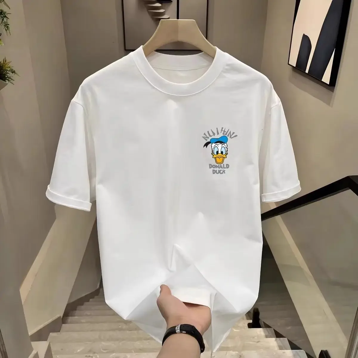 ديزني 2025 جديد حار دونالد داك نو Ihini الأسود تي شيرت الرجال النساء الصيف ملابس علوية من القطن سوق لندن طوكيو جامبل عرض النص طباعة