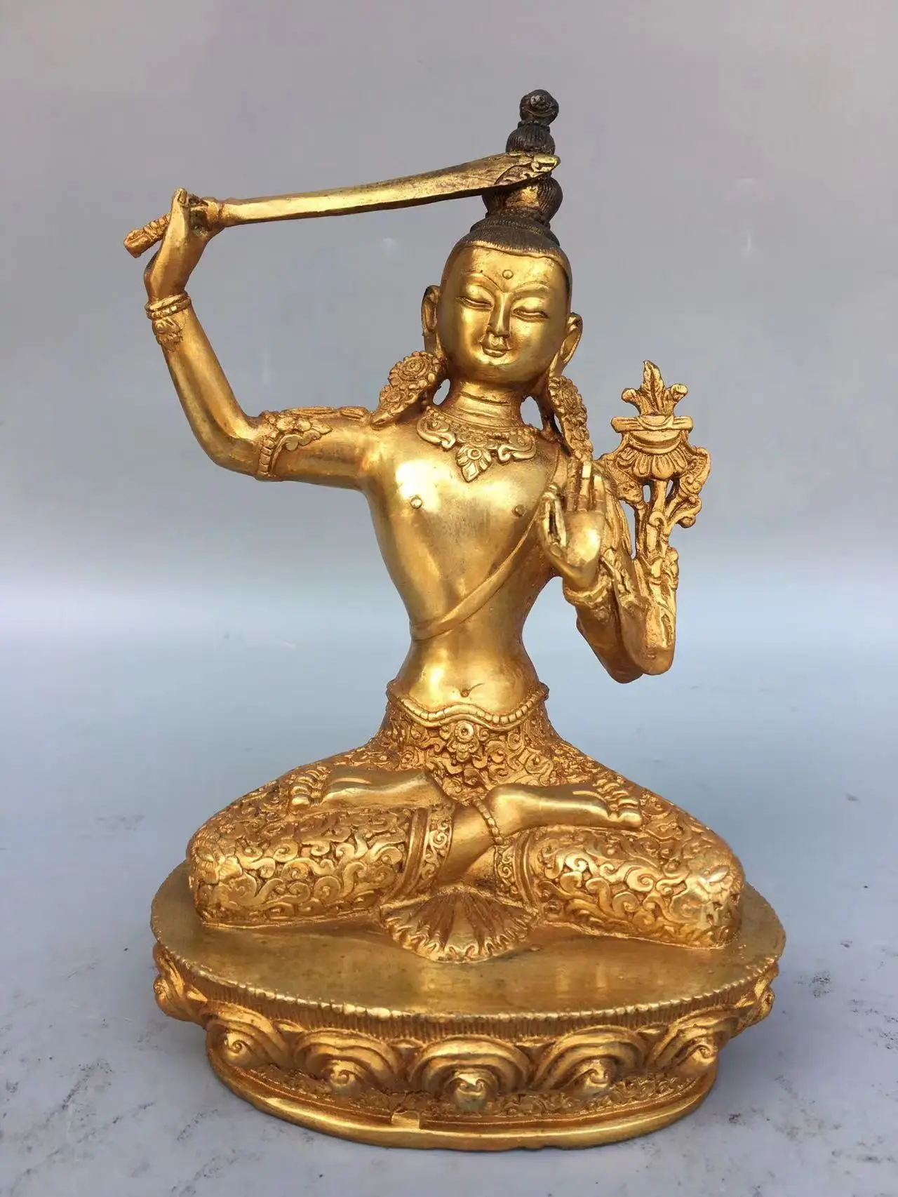 Antique Tibet copper sword-wielding statue of Tara Buddha statue