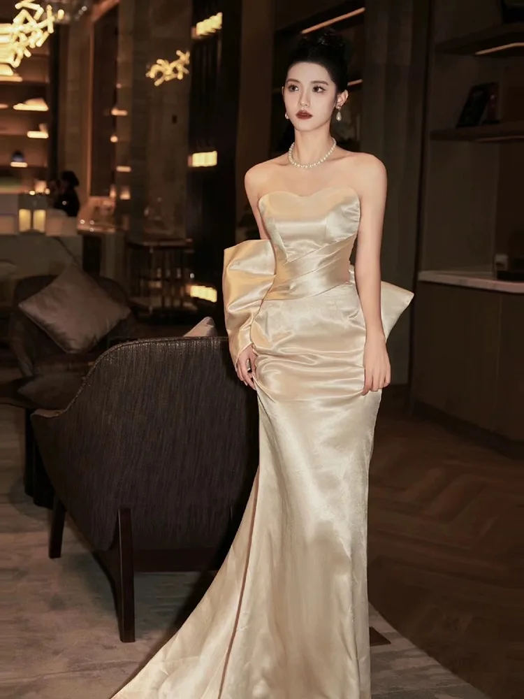 

Champagne Mermaid Evening Dresses Strapless Satin Bow Glossiness Sleevess Lace-up Red Carpet Shiny Evening Prom Gowns 2024