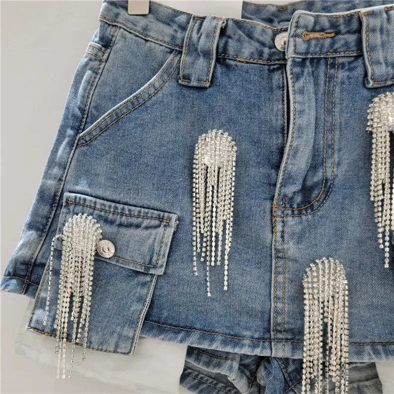

Edgy Western Fringe & Studded Denim Set. This cropped jacket and mini skirt feature distressed details for a bold street style.