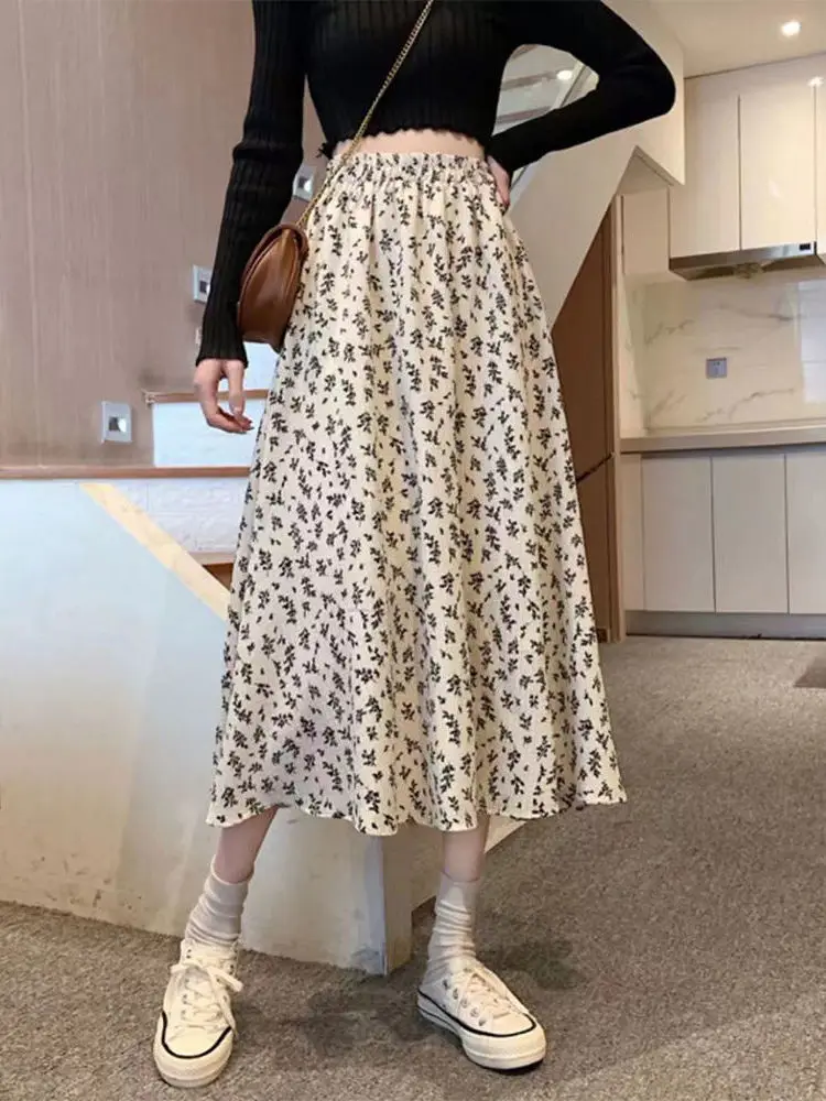 Spódnica midi w kwiatowy wzór plus size, rozkloszowana, wyszczuplająca, zakrywająca biodra, wiosenno-jesienna, damska, codzienna, z wysokim stanem, z włókna poliestrowego.