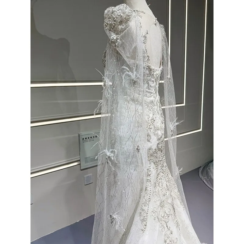 

A new elegant lace fishtail dress with light gauze feel for travel photography and welcoming guests