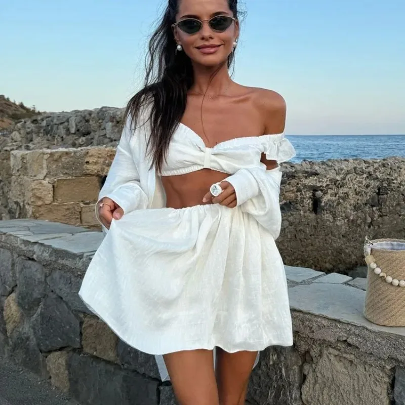 DINADD Sexy jupe blanche deux pièces ensemble femmes sans manches col fronde gilet taille haute jupe ensemble femme plage jupe décontractée ensemble