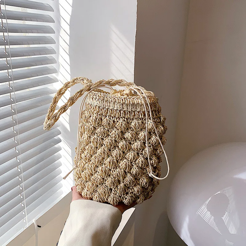 Straw Woven Bag 2022 New Bag Women's Beach Vacation Woven Bucket Bag Hollow Net Red Shoulder Messenger Bag Wholesale