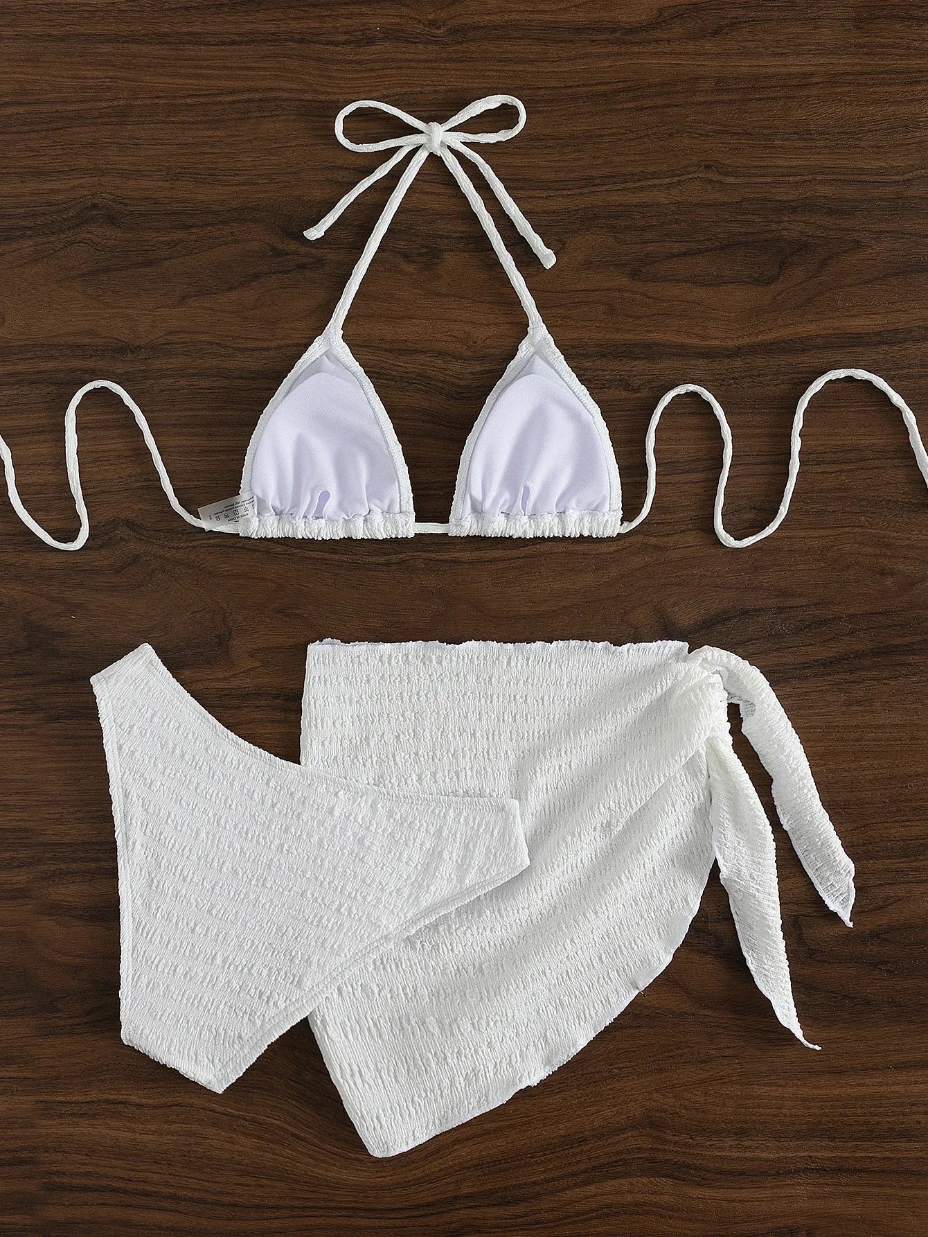 

White Smocked 3-Piece Swim Set: Halter Triangle Top, Hipster Bottom, And Wrap Skirt For Summer Beach