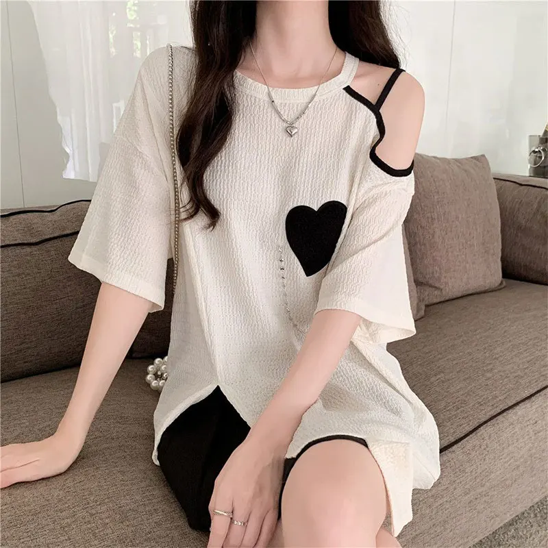 T-shirt con spalle scoperte o-collo da donna top larghi temperamento elegante abbigliamento Casual semplicità irregolare nuovo stile moda estiva