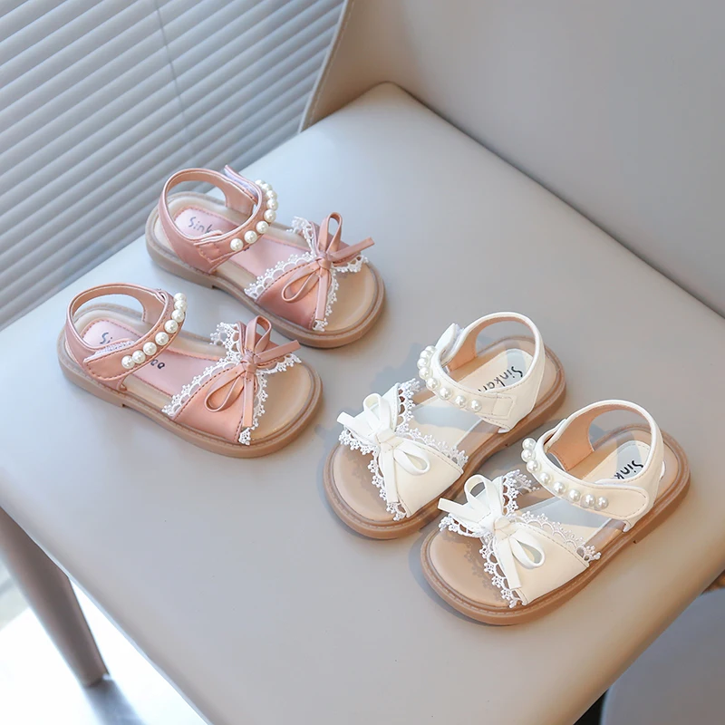 

2026 New Soft soled Fashion Anti slip Beach Shoes Explosive Butterfly Knot Pearl Decorative Sandals Versatile Children's Shoes