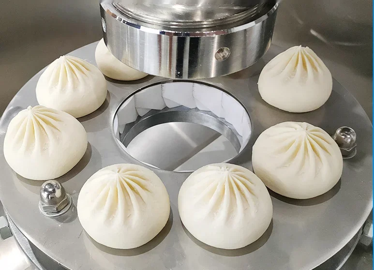 Steamed buns and dumplings forming and wrapping machine