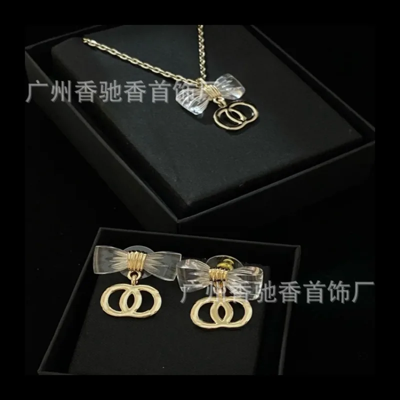 

New Transparent Crystal Bow Glazed Pearl Necklace Temperament Versatile Earrings Sweater Chain