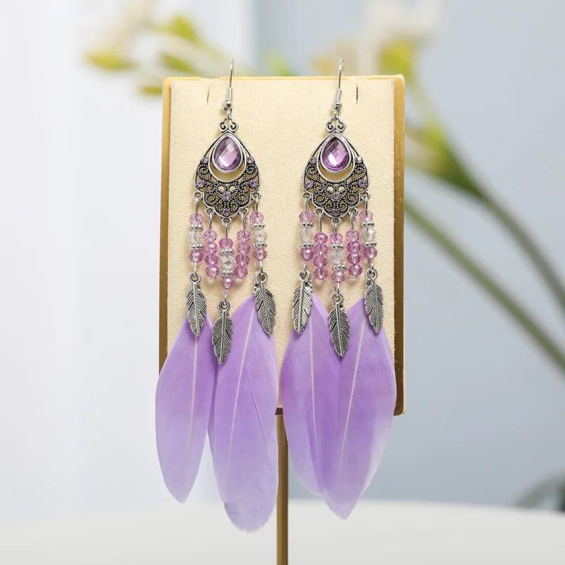 2026 الخاص بك Tixi البيضاوي مزاجه ريشة أقراط العرقية نمط كريستال أقراط Yunguichuan السفر المجوهرات بالجملة