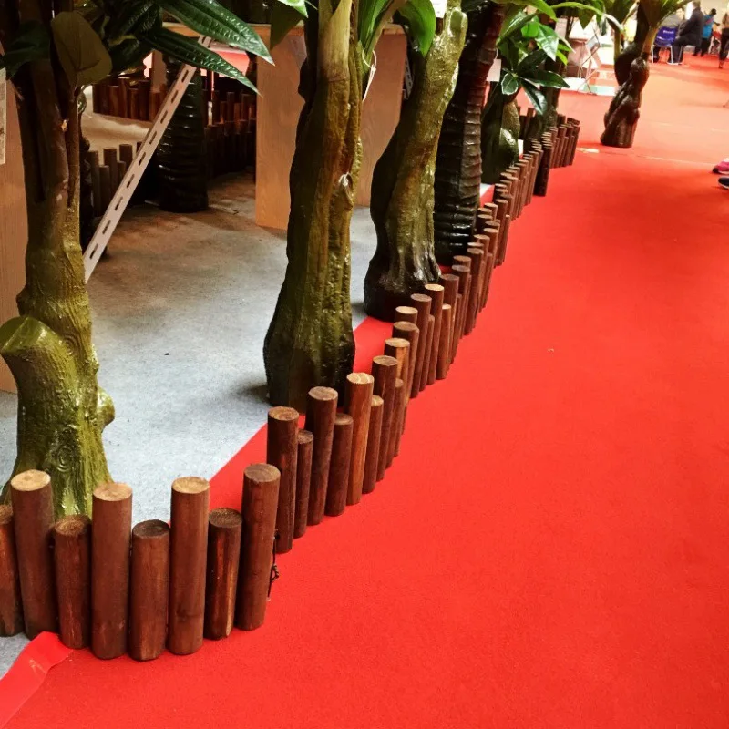 Decorative yard fence, antique old log stumps