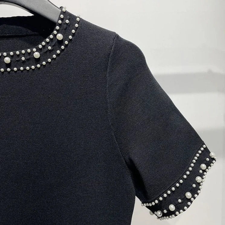 

Woman black knitted dress round neck short sleeve slim fit evening party midi robe